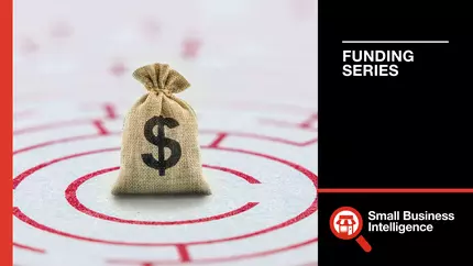 A burlap bag with a dollar sign sits in the middle of a red maze bullseye, preparing for emergencies